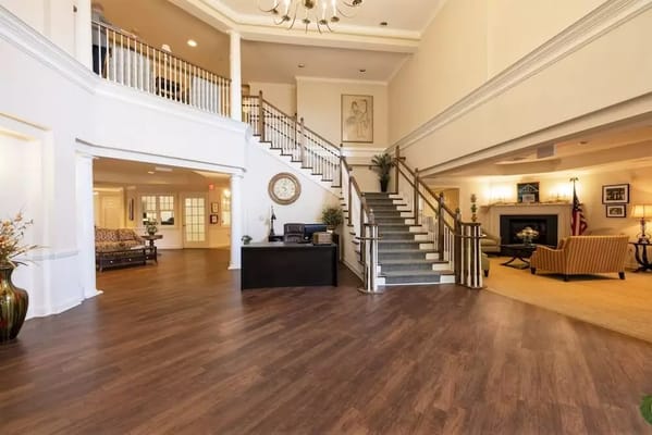 Spacious lobby with a staircase and reception area