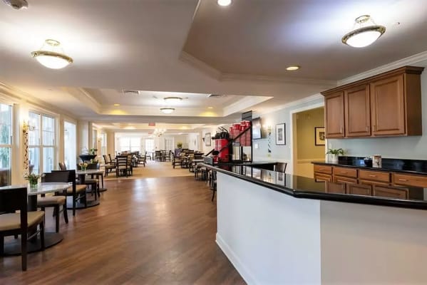 Bright common area with seating and dining tables