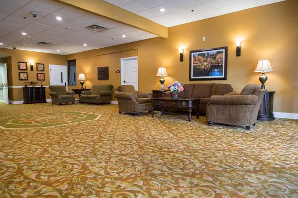 Spacious lounge area with comfortable seating and decorative lighting