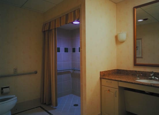 Interior view of a resident bathroom with shower