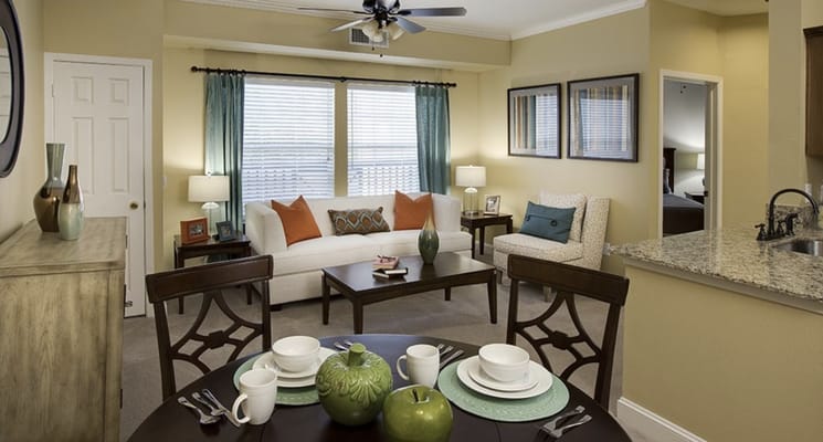 Spacious living room with modern decor and dining area