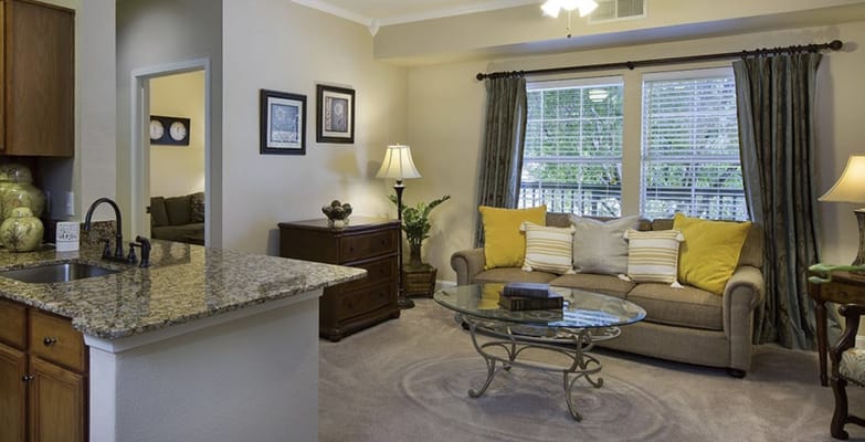 Inviting living room with a comfortable sofa and glass coffee table.