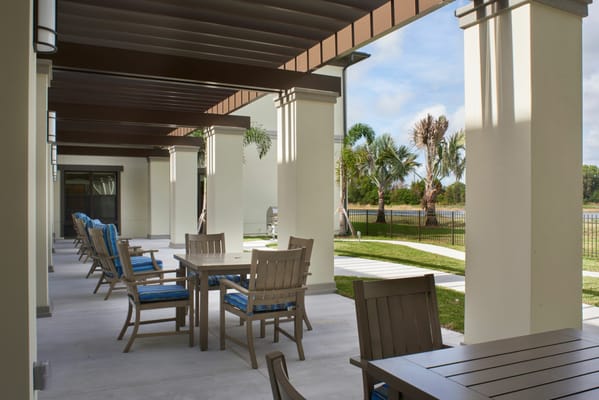Outdoor seating area with tables and chairs