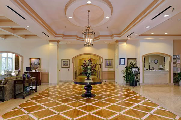 Interior view of the lobby featuring a decorative table and floral arrangement.
