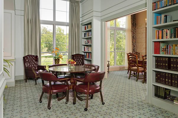 Bright common area with seating and bookshelves