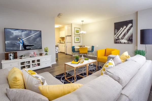 Bright common area with modern décor and kitchen view