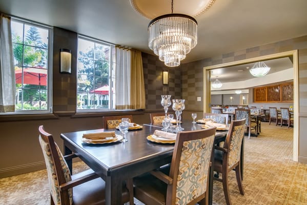 Dining table set for a meal in a well-lit dining room