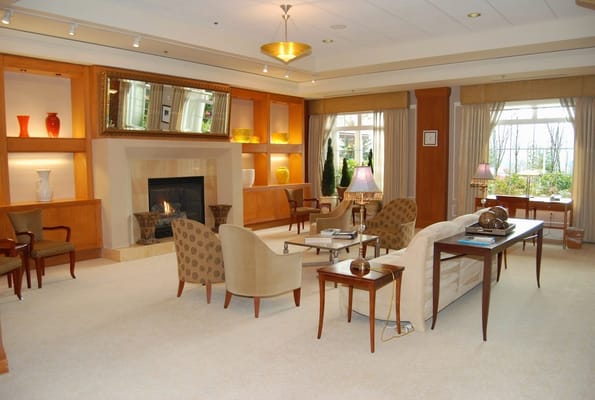 Warm and inviting living room with seating and a fireplace