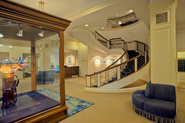 Interior view of the lobby with staircase and artwork.