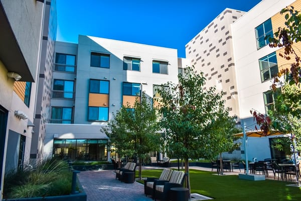 Exterior view of the facility courtyard with seating