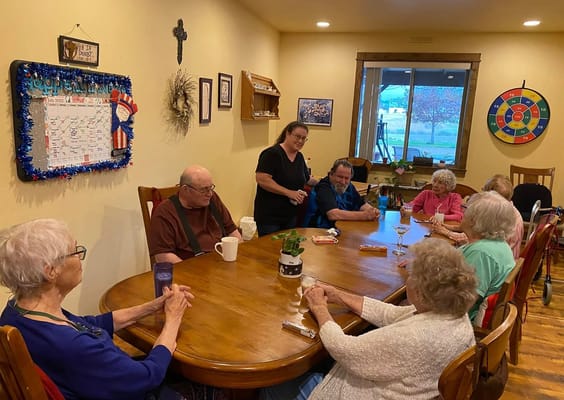 Residents enjoying a game night around a table