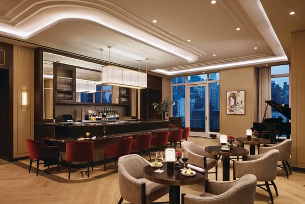 Elegant dining area with a bar and piano