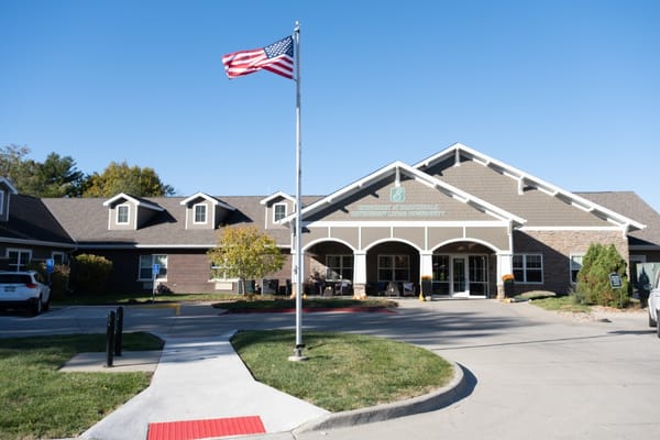 Exterior view of Edencrest at Beaverdale with flag