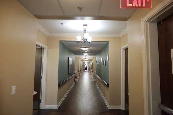 A long corridor inside the facility with decorative lighting
