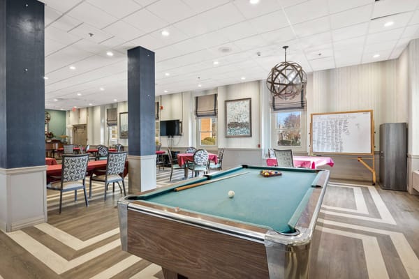 Interior view of a common area with a pool table