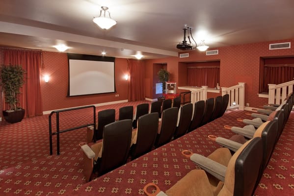 Interior of a movie theater with seating and screen