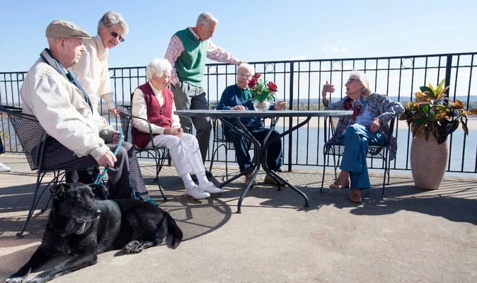 Seniors enjoying time outdoors at a table