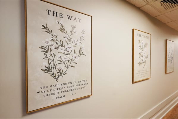 Decorative wall art in a common area hallway