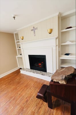 Cozy interior space with a fireplace and shelves