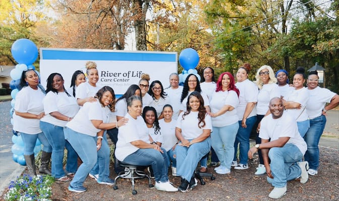 Staff gathering outside the River of Life Care Center