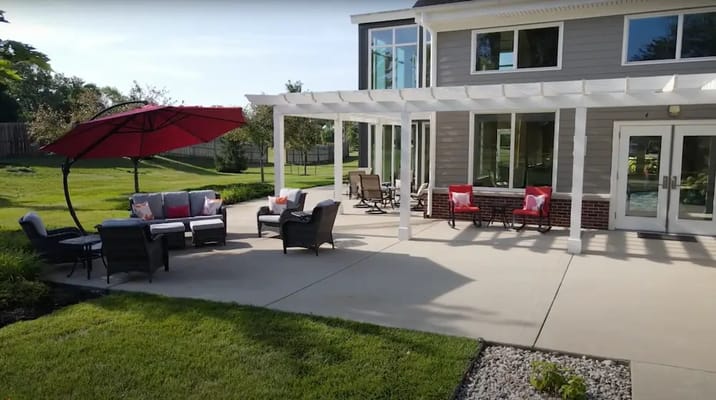 Outdoor seating area with umbrellas and patio furniture