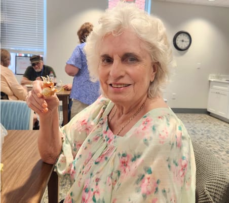 A resident enjoying a snack in a common area