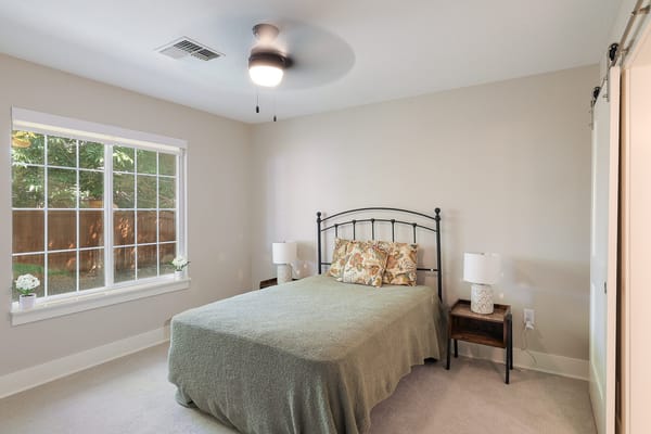 Cozy private resident room with a bed and window