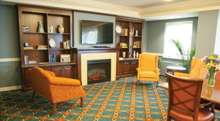 Cozy common area with seating and a fireplace