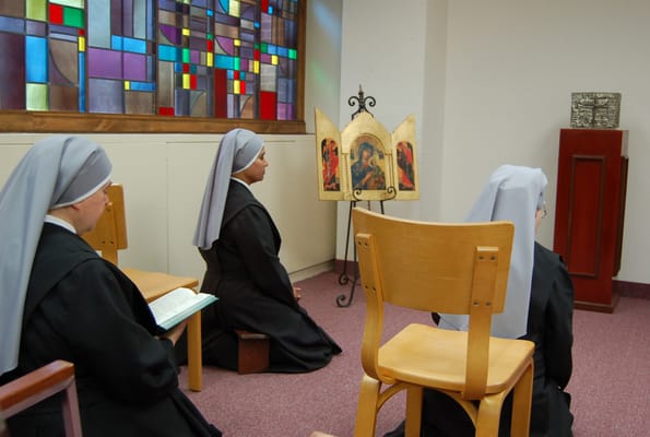 Residents participating in a prayer session in a chapel