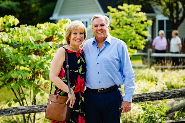 A couple posing in a garden setting at the facility