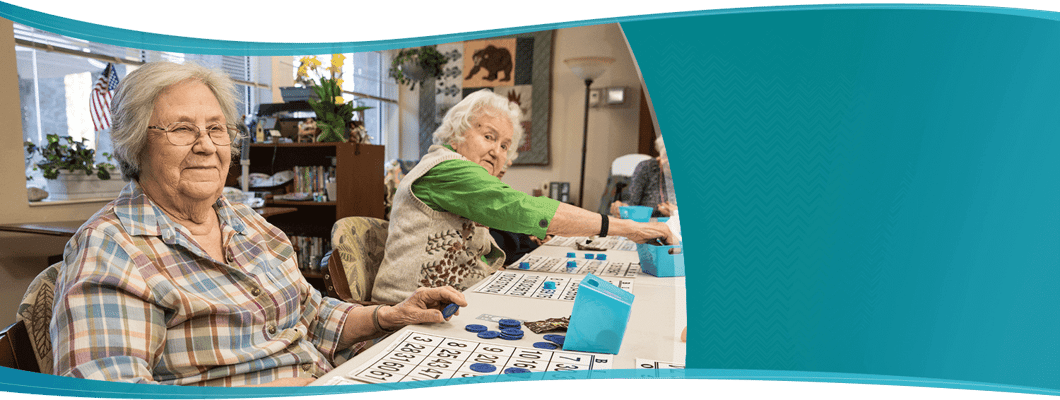 Residents engaging in a bingo game in an activity room