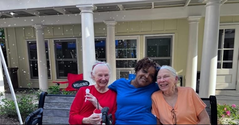 Residents enjoying an outdoor activity with bubbles