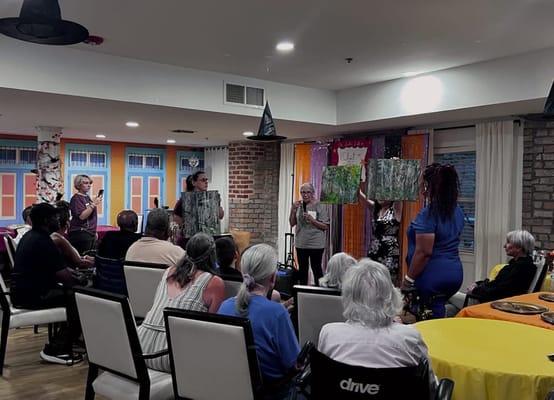 Residents engaged in an art activity in a common area
