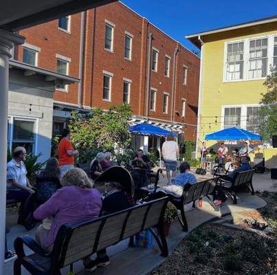 Residents enjoying music outdoors in a common area
