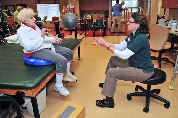 Resident engaging in therapy with a staff member