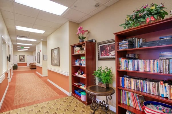 Interior hallway with bookshelves and decor