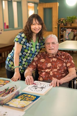 A staff member and resident enjoying an activity together