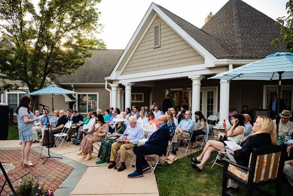 Residents gathering in an outdoor space for an event
