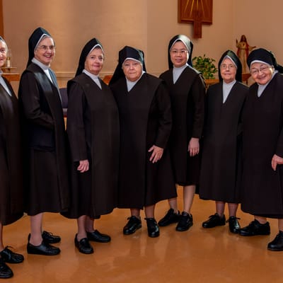 Sisters in traditional attire standing together