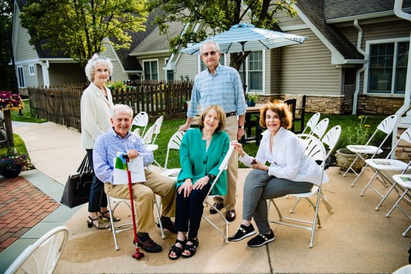 Residents socializing outdoors in a courtyard
