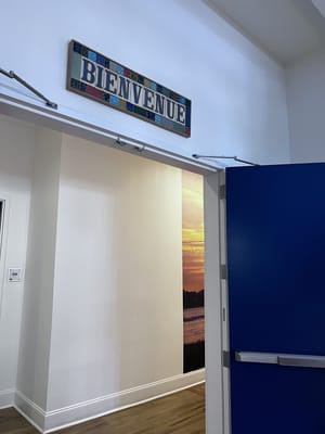 Interior view showcasing a greeting sign in multiple colors