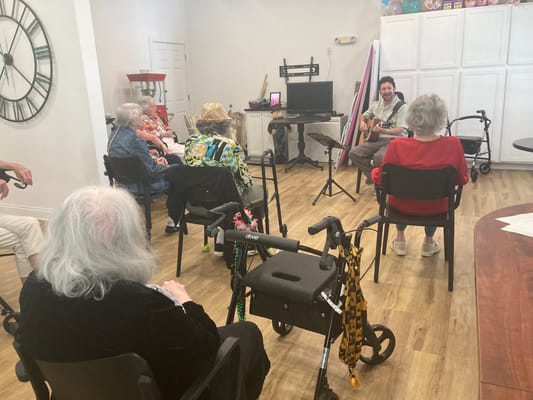 Residents enjoying a live music performance in a common area