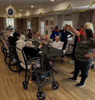 Residents and staff celebrating together in a common area