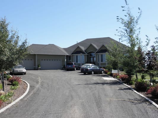 Exterior view of a senior living facility with parking