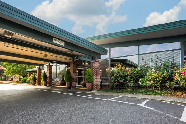 Exterior view of Life Care Center of Puyallup with landscaping