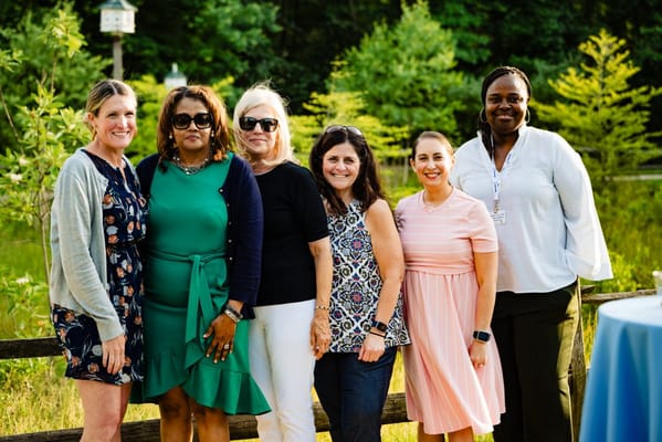 Group of staff members posing outdoors
