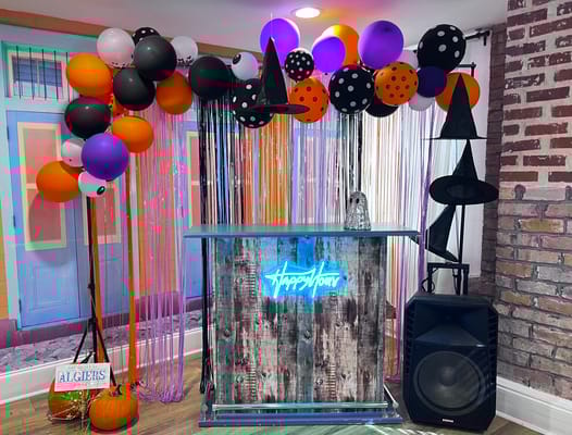 A festive bar area decorated for a Halloween event