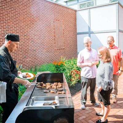 Residents enjoying a barbecue in the garden