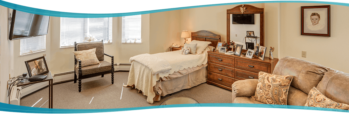 Cozy resident room with bed and seating area