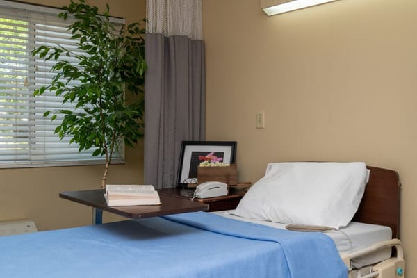 A well-maintained private room with a hospital bed